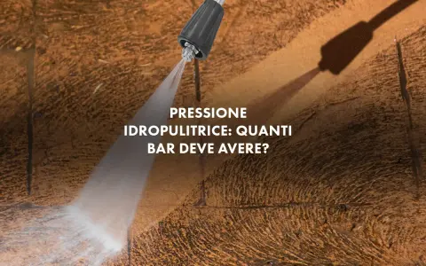 Ugello idropulitrice spruzza acqua su una superficie ruvida. La domanda è: quanti bar deve avere una buona idropulitrice per pulire efficacemente?