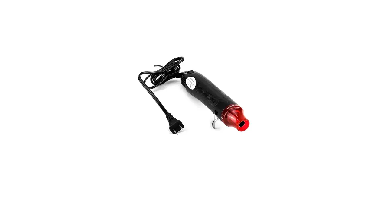Pistola termica con cavo e spina. Il corpo nero ha una texture a fibra di carbonio e un ugello rosso. Ideale per controllare la temperatura.